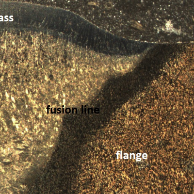 Macrography of the pipe to flange weld. Transverse section identifying the regions of the base materials, heat affected zones and weld metal, which microstructures are presented in this ML.