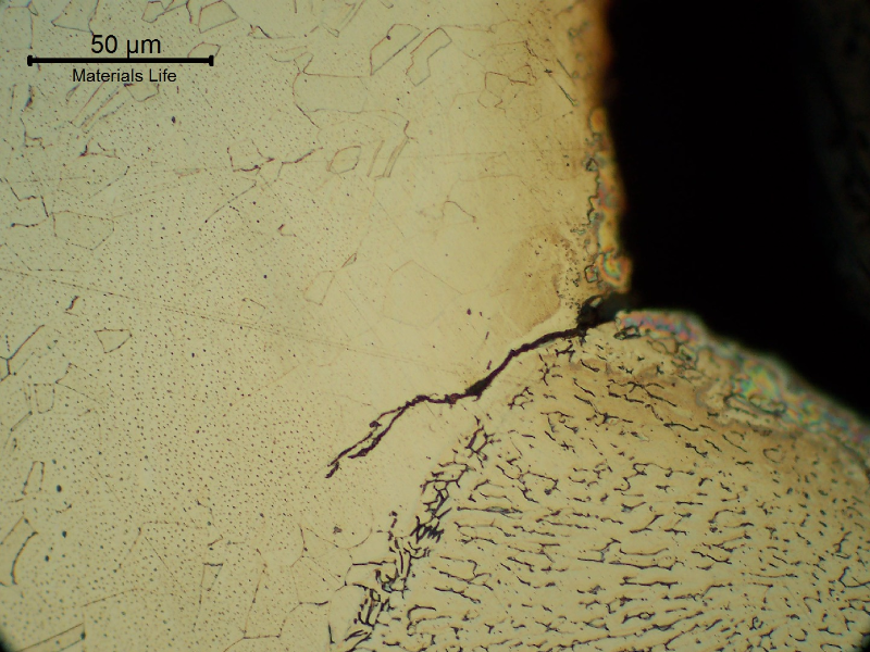 Micrographic detail of the fatigue cracking at the margin of the flange to shell fillet weld.