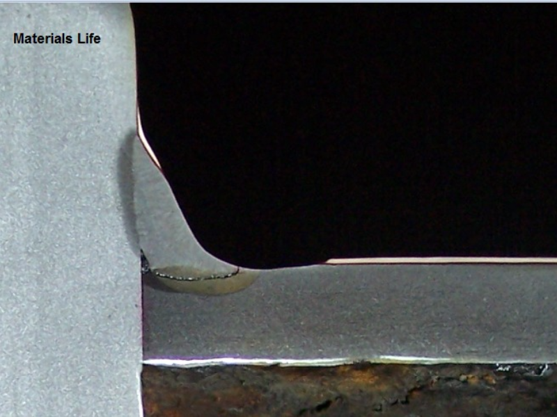 Macrography of the fillet welded joint between the 3" ND tube and the 3/4" thick plate. See the schematic drawing in the next figure