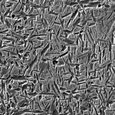 Micrographic detail of the ferritic structure in the weld metal close to the low alloy steel tube, by scanning electron microscopy.  The weld metal presents a typical aspect for high strenght weld metal (100% acicular ferrite).