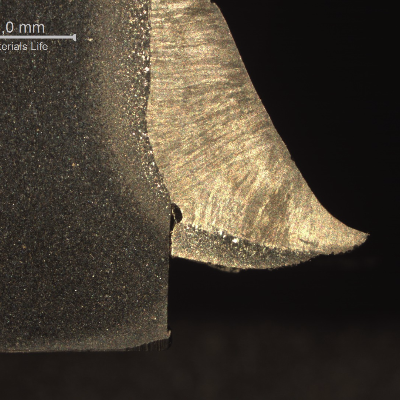 Macrography showing the different regions of a pipe-to-plate fillet weld. See the schematic drawing in the next image
