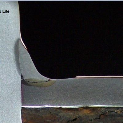 Macrography of the fillet welded joint between the 3" ND tube and the 3/4" thick plate. See the schematic drawing in the next figure