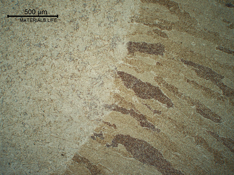 Fusion line of the first pass (reheated in high temperature).  The HAZ is bainitic and the weld metal microstructure is predominantly formed by acicular ferrite.