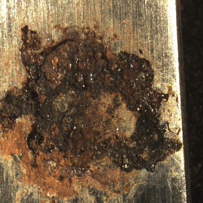 Detail of the rusted surface of the knife, before cleaning.
