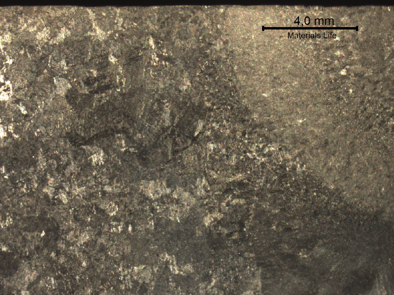 Macrography of a transverse section of the welded joint between the original casting and the inserted casting, in the side of the original part.