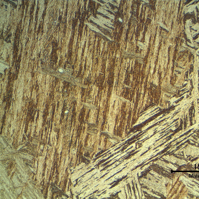 Original casting base metal presenting a coarse martensitic structure with a small amount of delta ferrite.