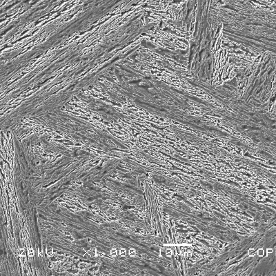 Micrographic detail of the original casting blade structure. The tempered martensite is more clearly revealed by the scanning electron microscopy. The average hardness level measured in this side is 270 HV.