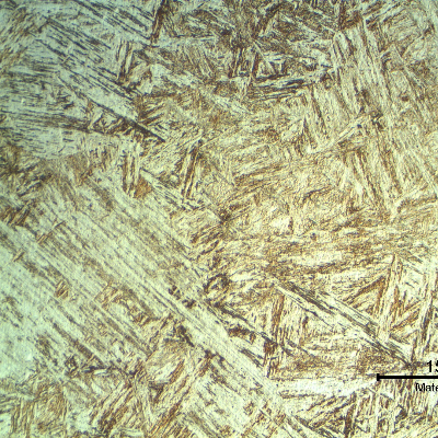 Inserted casting base metal presenting a coarse martensitic structure with a small amount of delta ferrite.