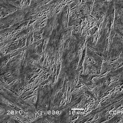 Micrographic detail of the inserted casting structure. The martensite presents a less tempering aspect than the original casting revealing that it was heat treated in a different condition. The average hardness level measured in this side is 370 HV.