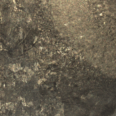 Macrography of a transverse section of the welded joint between the original casting and the inserted casting, in the side of the original part.