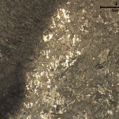 Macrography of a transverse section of the welded joint between the original casting and the inserted casting, in the side of the inserted part.