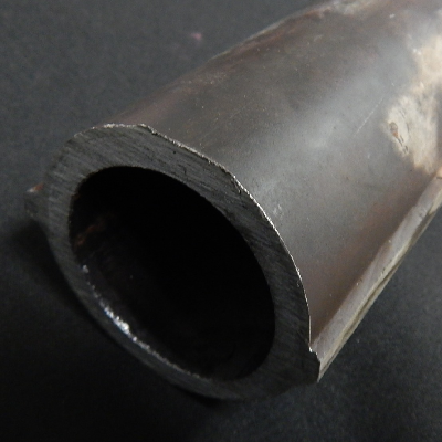 The 2 1/2" nominal diameter seamless tube is externally cladded with stainless steel.