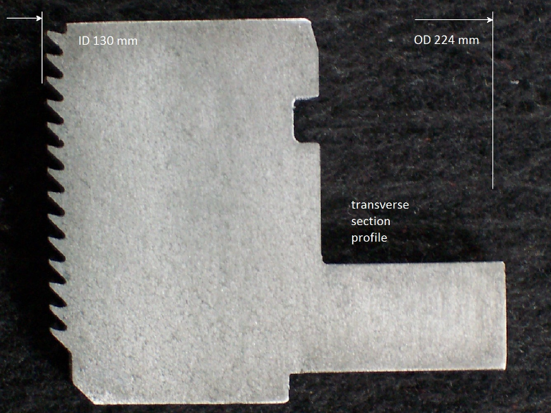 Macrography of a transverse section of the ring piston seal, shwing a thread in the internal diameter.