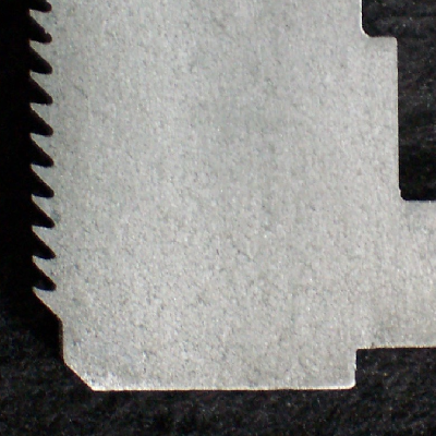 Macrography of a transverse section of the ring piston seal, shwing a thread in the internal diameter.