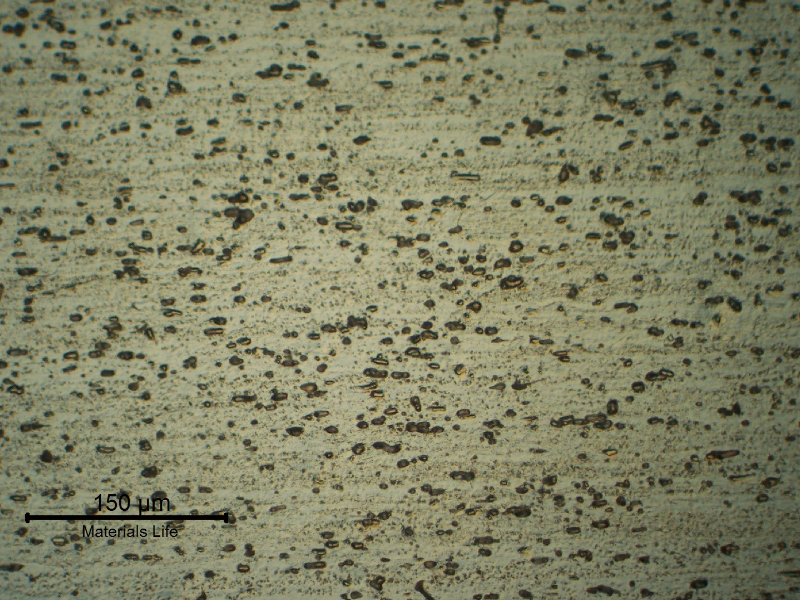 Micrography of a longitudinal section of the pipe AA 3003. Granular structure that reveals the forming direction and dispersed particles.