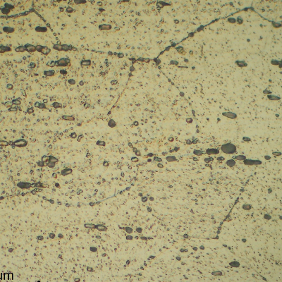 Micrographic detail of a longitudinal section of the pipe AA 6063. Granular structure and dispersed particles.