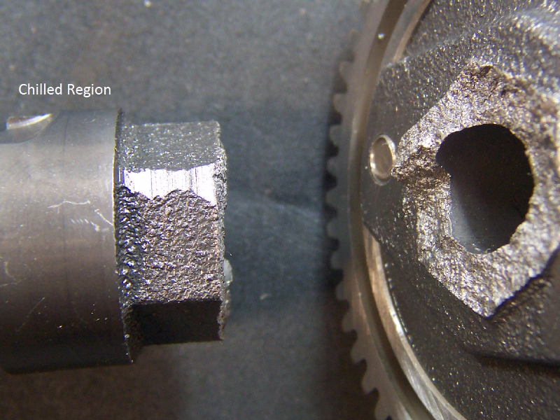 Camshaft in the broken region, close to a lobe where the cast iron was chilled.