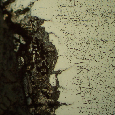 Micrographic detail of the circumferential butt weld, close to the internal surface, at the localized corrosion in the margin of the weld.