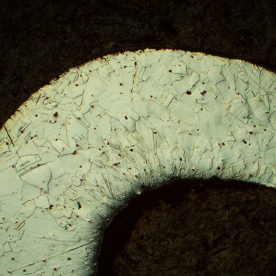 Micrography of the nut in the longitudinal direction, at the Nylon insert position, showing a cold formed region at the end of the nut, with high hardness levels (about 600 HV100g).