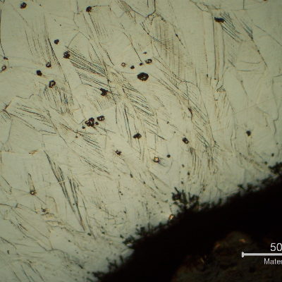 Micrographic detail of the nut at the cold formed region where the nut was bent over the Nylon insert.  It is possible to see strain hardened structures (600HV 100g).