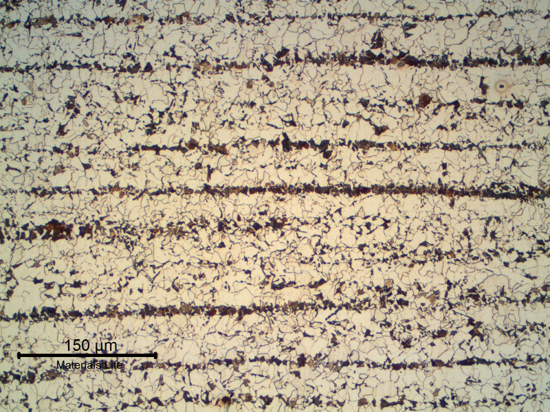Micrography of a longitudinal section of the 1" plate, in the center of the thickness, presenting a refined ferritic perlitic microstructure. Banded.