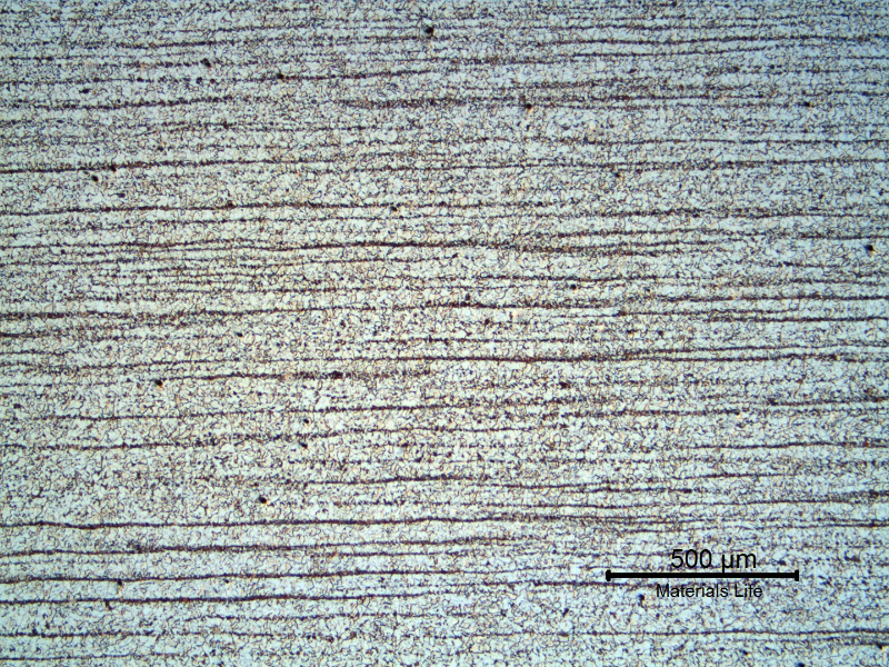 Micrography of a longitudinal section of the 1" plate, in the center of the thickness, presenting a refined ferritic perlitic microstructure. Banded.