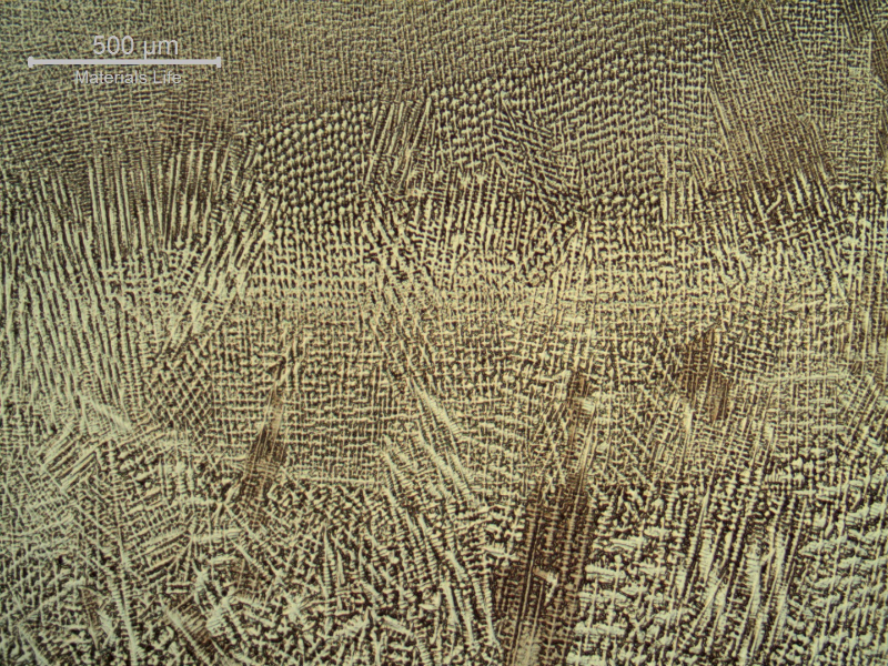 Micrography of the weld metal in the center, showing the interface between weld beads in different passes.