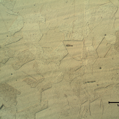 Elbow base metal micrographic detail presenting a granular microstructure. Like the pipe, the microstructure reveals inclusions.