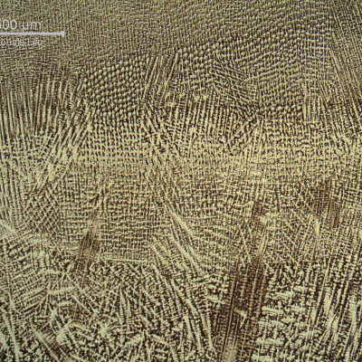 Micrography of the weld metal in the center, showing the interface between weld beads in different passes.