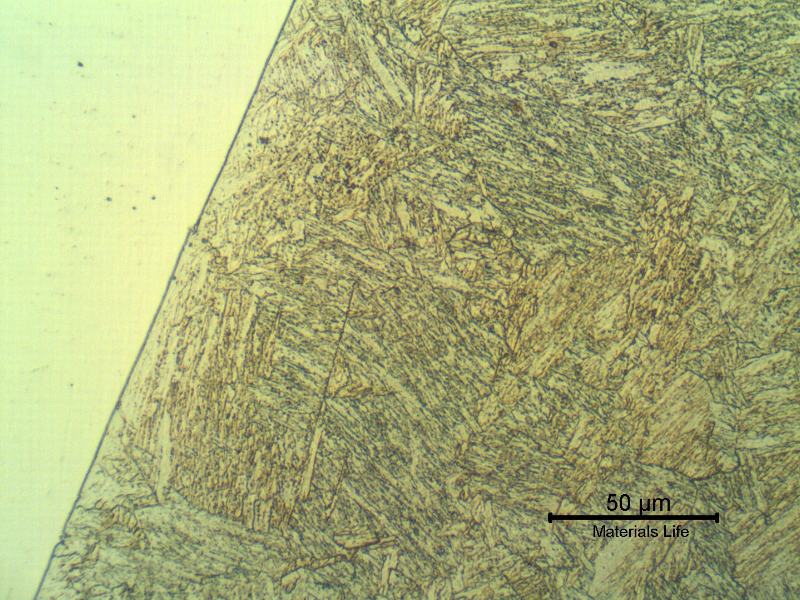 Micrographic detail of the fusion line in the center of the thickness, where the heat affected zone was reheated by the subsequent passes.