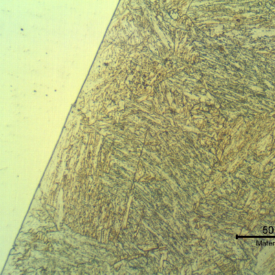 Micrographic detail of the fusion line in the center of the thickness, where the heat affected zone was reheated by the subsequent passes.