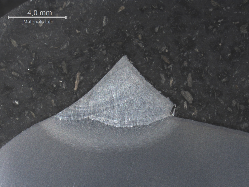 Macrography of the welded joint in a cracked region.