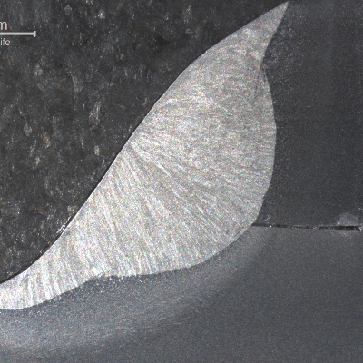 Macrography of the welded joint in a non cracked region.