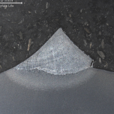 Macrography of the welded joint in a cracked region.