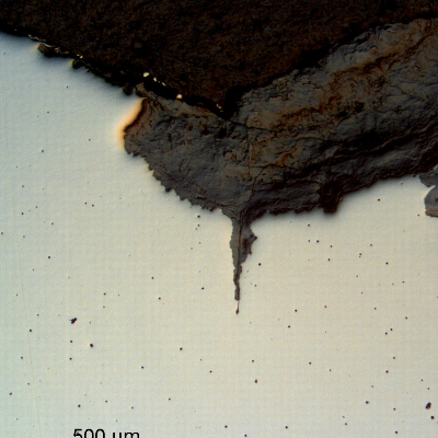 The micrography in the as polished condition of the longitudinal section of the pipe close to the washout, shows that at the tool mark tip (notch from the external surface) a fatigue crack already started from a corroded region (pitting).