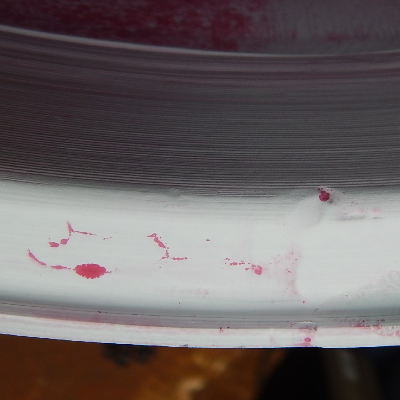 Aspect of the welded region after dye check showing several indications, later identified as hot cracks associated to the repair welding.