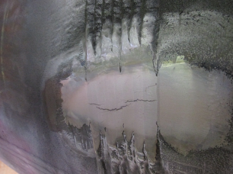 Aspect of the butt welded joint surface, after grinding to remove the reinforcement, polishing and macro etching.  There are multiple cracks, transverse to the weld and restricted to the weld metal.  The surface hardness are 167HB for the tube (left side), 180 HB for the Forged T (right side) and 272 HB for the weld metal, suggesting lack of a suitable PWHT.