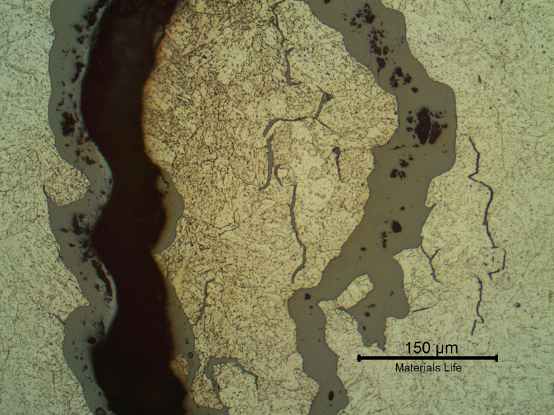 Micrographic aspect of opened cracks, filled with oxides.