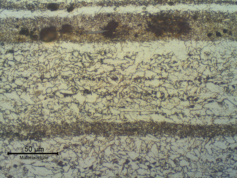 Micrographic detail of the X65 pipe, 5/8" thickness, in the longitudinal section. The refined ferritic structure with bainitic bands is responsible for obtaining the 65 Ksi YS for a low carbon manganese ferritic structure.