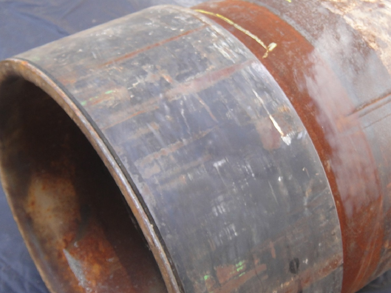 The connector was welded to the pipe from both (internal and external) sides, a PWHT was applied and the part was machined.  The UT indication was detected during final inspection.