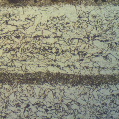 Micrographic detail of the X65 pipe, 5/8" thickness, in the longitudinal section. The refined ferritic structure with bainitic bands is responsible for obtaining the 65 Ksi YS for a low carbon manganese ferritic structure.