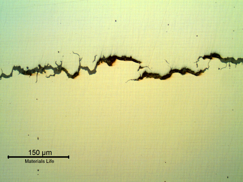 Multiple intergranular cracks transverse to the bolt axis. Hydrogen assisted cracking due to cathodic protection of a high strenght steel. Micrography in the "as polished" condition.