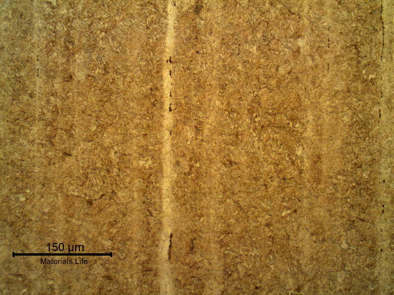 Tempered martensitic structure of a longitudinal section of the fastener. Slightly banded material. Hardness level about 42 HRc.