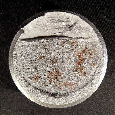 Fracture view presenting two diferente aspects, brittle in the bottom of the figure and in the center (most part of the fracture) and ductile in the top of the figure. Nominal diameter of the bolt 1 1/2".