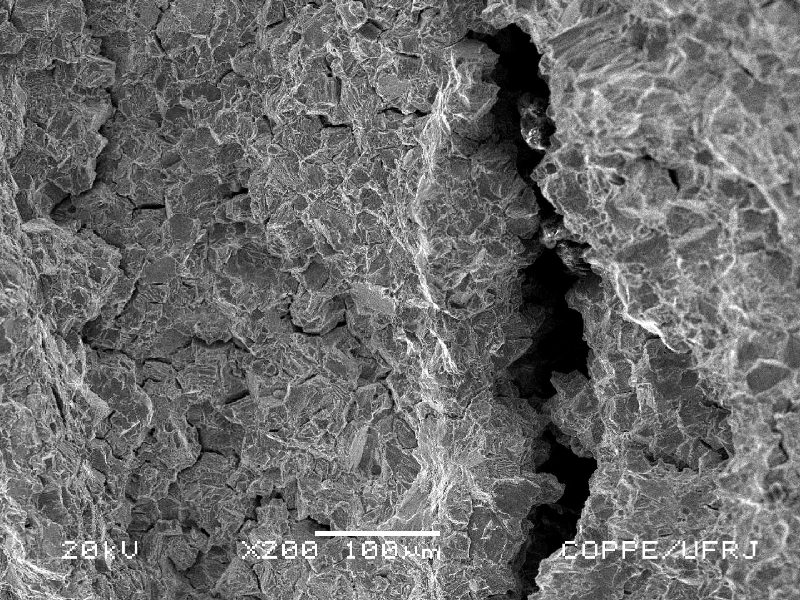 The secondary cracks are easily observed in the fracture surface, longitudinal to the axis of the stud.