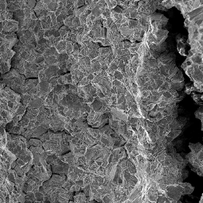 The secondary cracks are easily observed in the fracture surface, longitudinal to the axis of the stud.