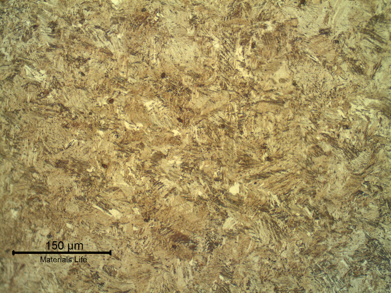 The transverse section of the spring wire shows a strain hardened martensitic structure, aged to high strength (602 HV 0.3kg).