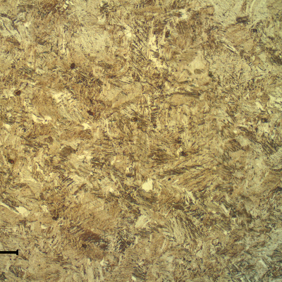 The transverse section of the spring wire shows a strain hardened martensitic structure, aged to high strength (602 HV 0.3kg).
