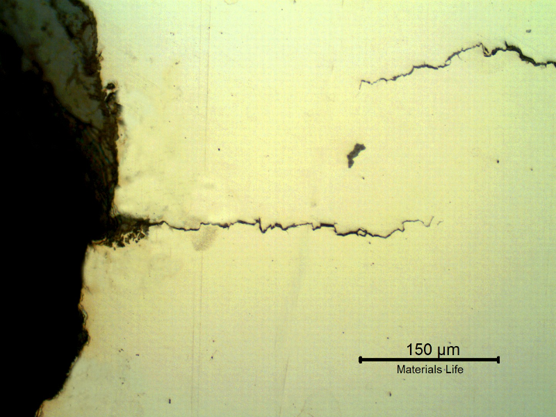Multiple intergranular cracks transverse to the bolt axis. Hydrogen assisted cracking due to cathodic protection of a high strenght steel. Micrography in the "as polished" condition.