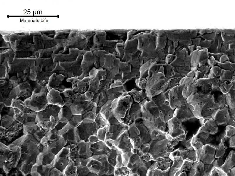Scanning electron fractography of a chromium plated pin, close to the pin surface where the fatigue cracking started, showing intergranular morphology typical of a hydrogen embrittlement effect. It occurred because the low alloy pin was carburized, quenched and tempered, with a too high hardness structure, before the electrolytic plating.